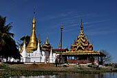 Inle Lake Myanmar. All the buildings are constructed on piles. Residents travel around by canoe, but there are also bamboo walkways and bridges over the canals, monasteries and stupas. 